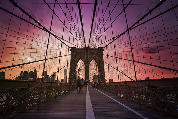 Walk through the Brooklyn Bridge at the Sunrise in the Morning 